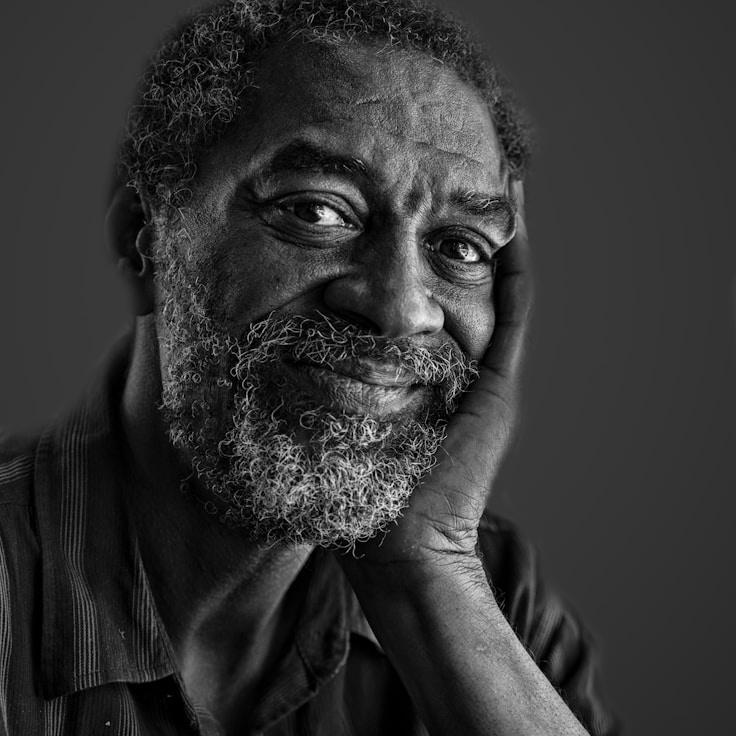 Alex Rivera, Lead Design Curator at GladeHarborRest, reviewing corporate floral arrangements